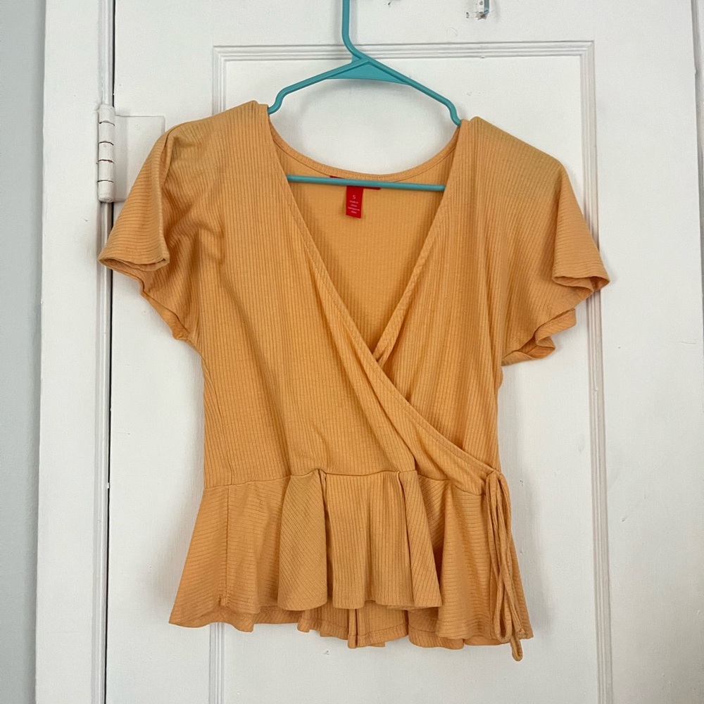 small orange cross over shirt